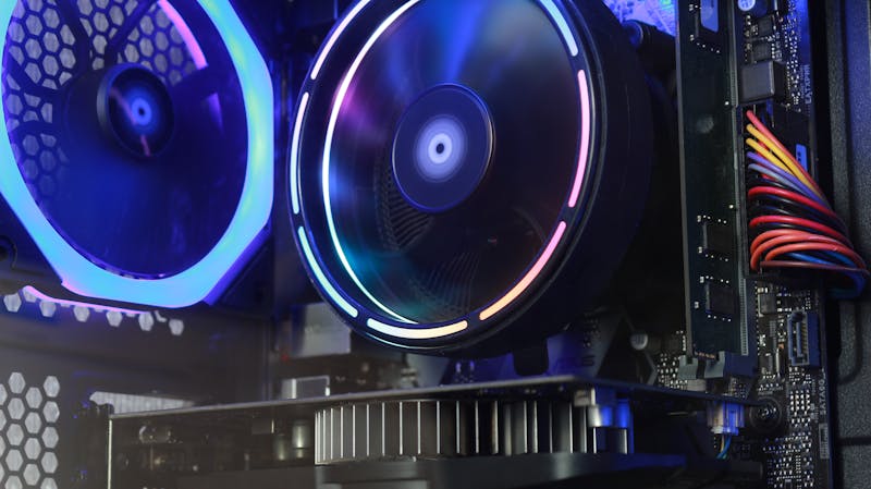 Person reading tarot cards on a table with warm lighting