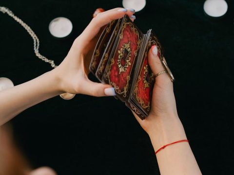 Collection of tarot cards and guidebooks for beginners