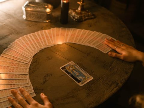 Multiple tarot decks displayed showing different card designs for beginners