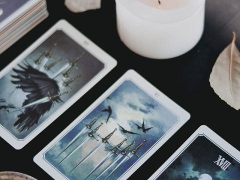 Tarot cards arranged in a spread pattern for divination reading