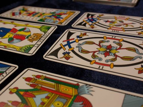 Rider Waite tarot cards spread out showing detailed illustrations
