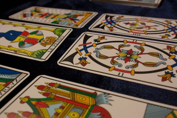 Rider Waite tarot cards spread out showing detailed illustrations