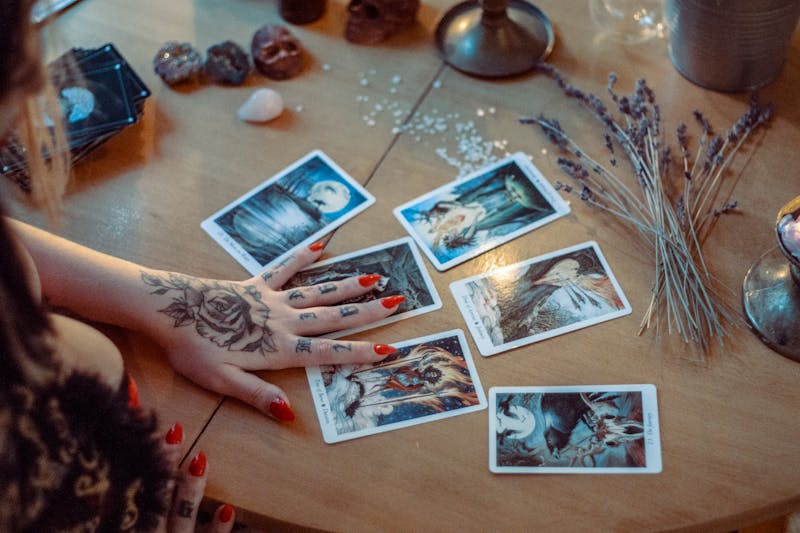 Tarot cards spread across a table for a reading