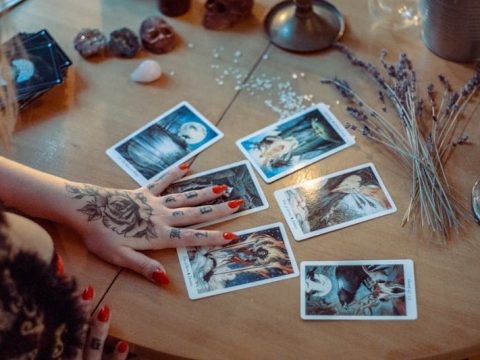 Tarot cards spread on a table showing Major Arcana meanings